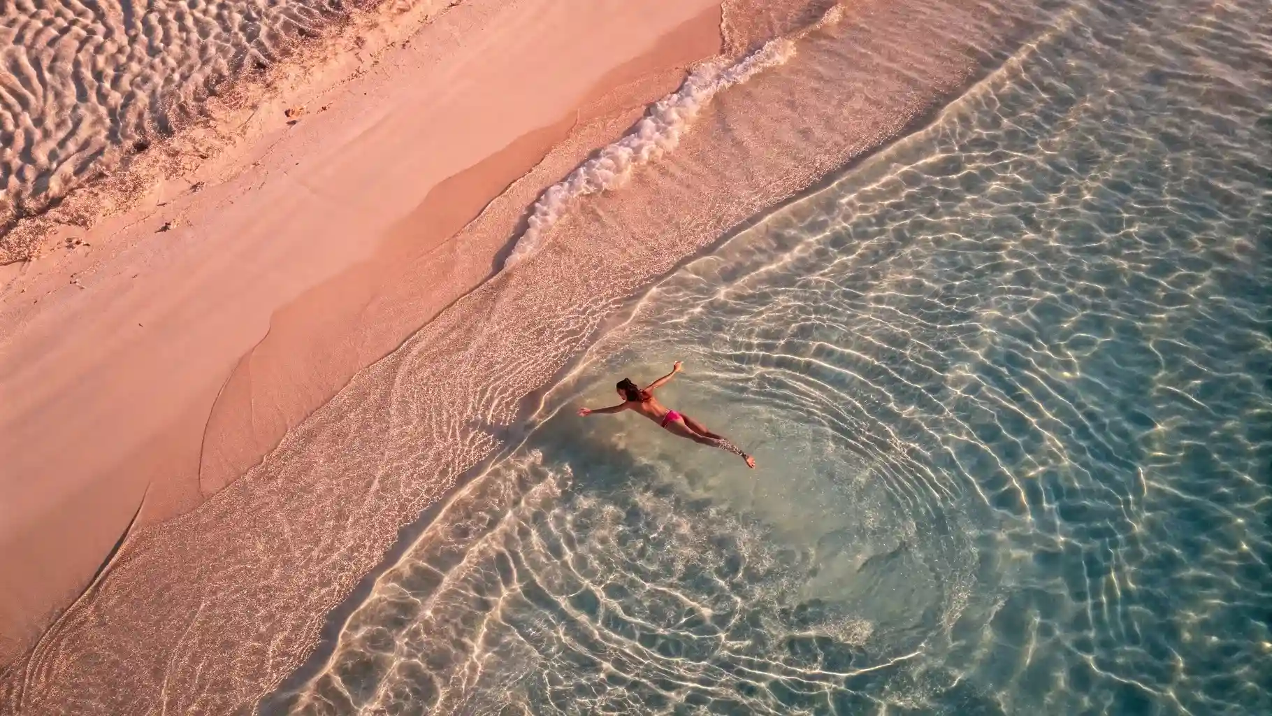 Pink sand and shallow reef at Pink Beach, Komodo
