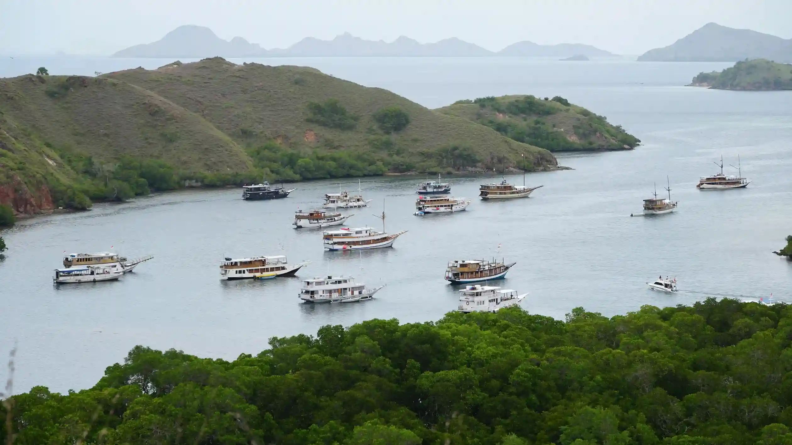 A boat sailing between the islands of Komodo National Park